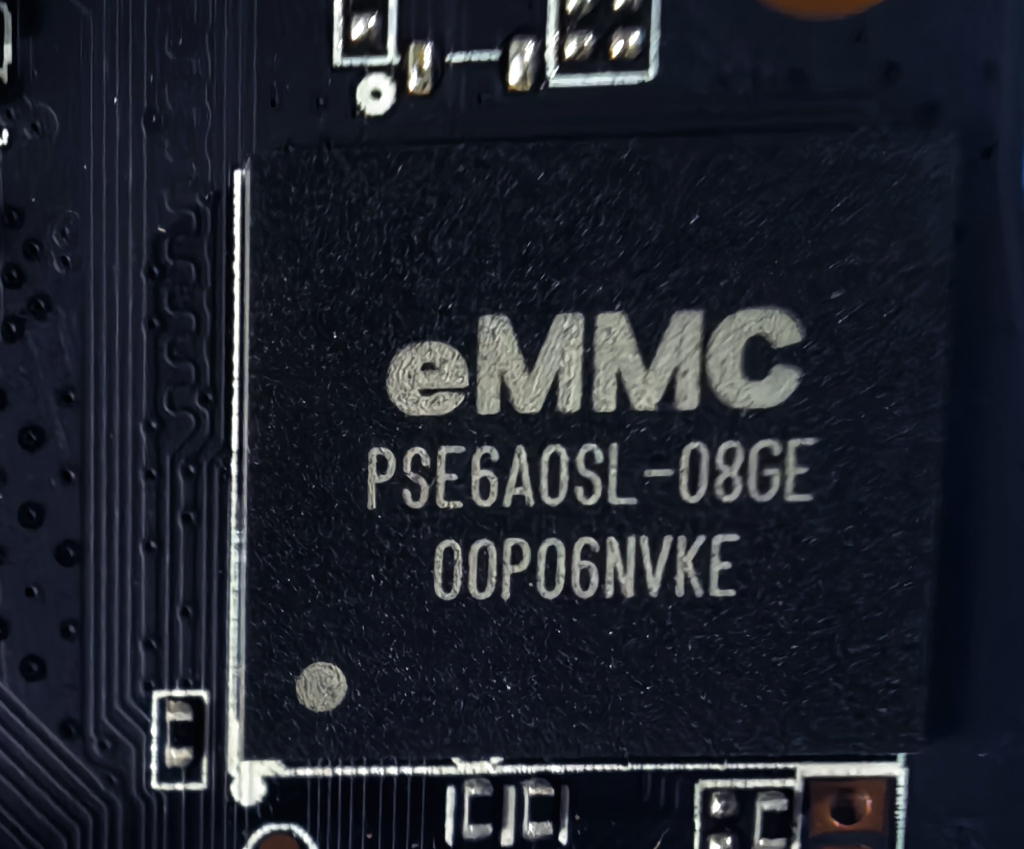 Close-up photograph of a packaged eMMC storage chip on a circuit board; product category reference, not a live-stock listing